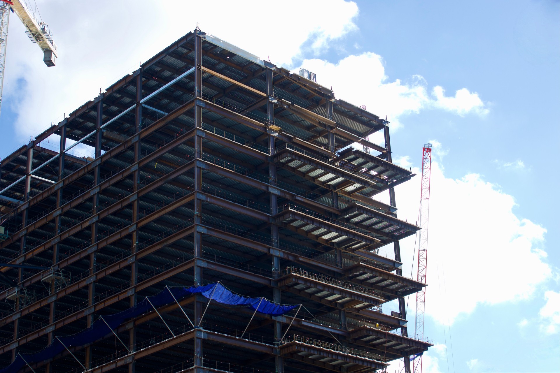 Downtown high rise under construction with cranes